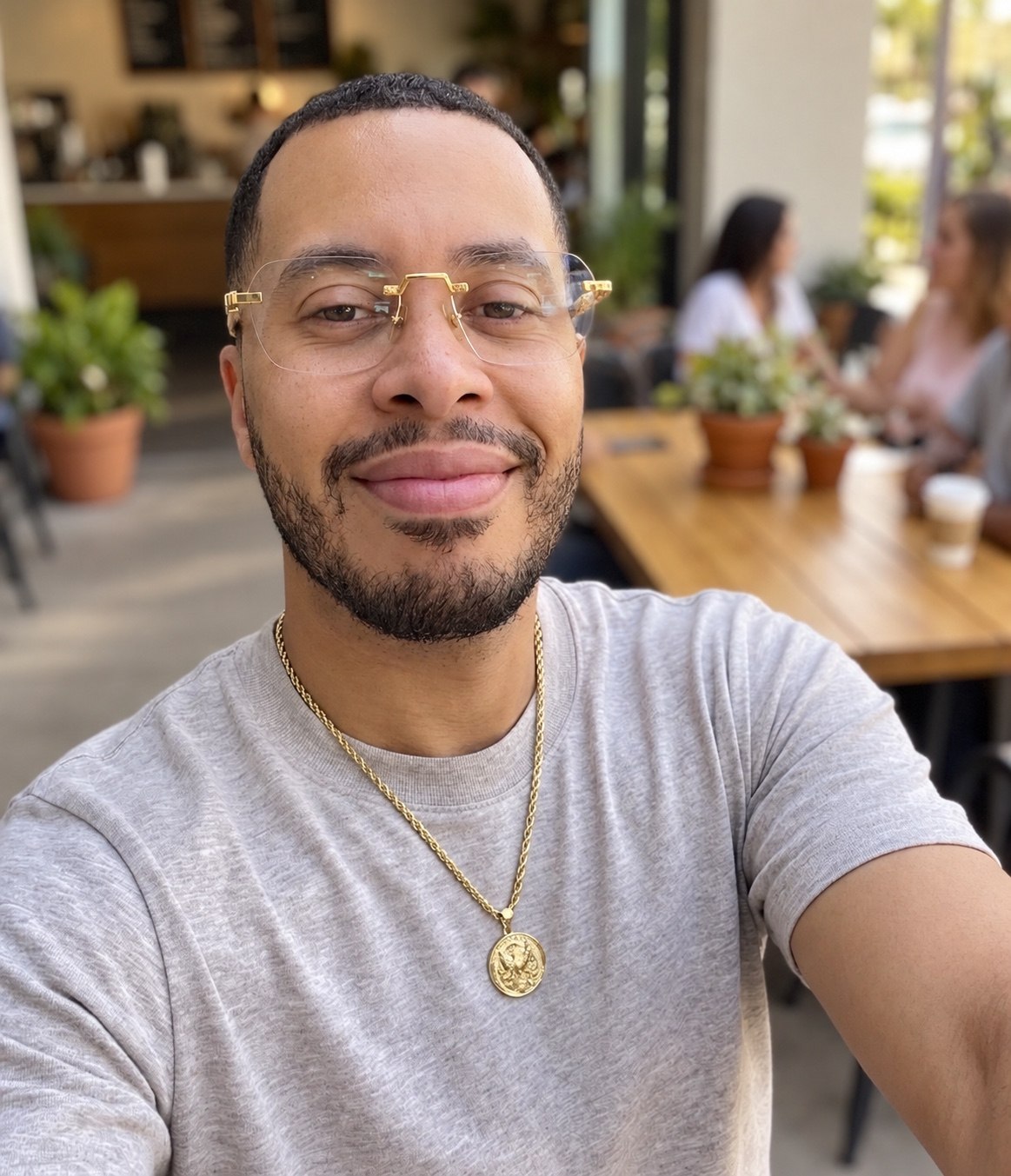 Brandon Brown sitting outdoors at a café